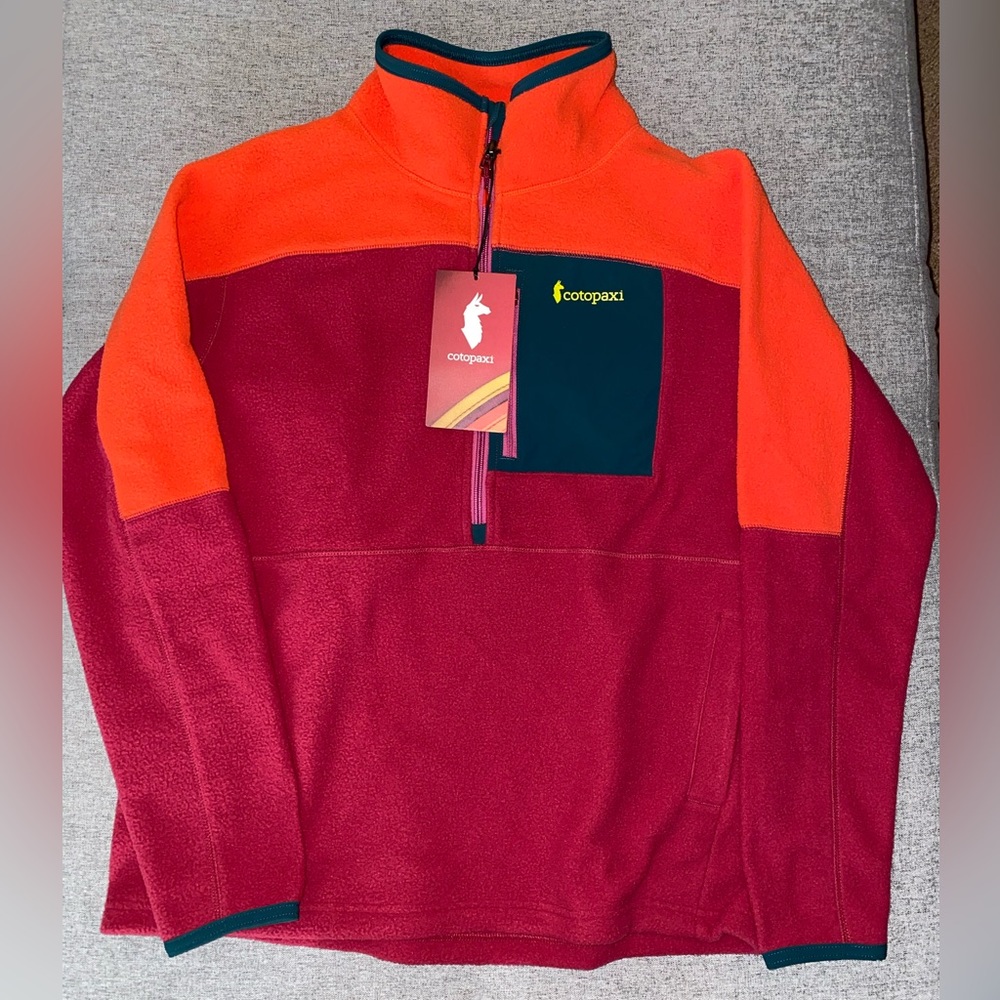 Cotopaxi cute bright half-zip fleece jacket.
